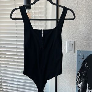 Abercrombie black bodysuit with hooks in chest area. Size medium.  Never worn.